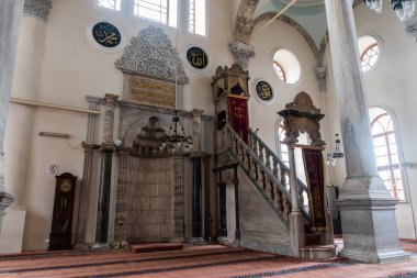 Izmir, Turkey - January 26, 2019. Interior view of Kestanepazari mosque, dating from 1668, in Izmir, with prayer hall, mihrab and minbar.