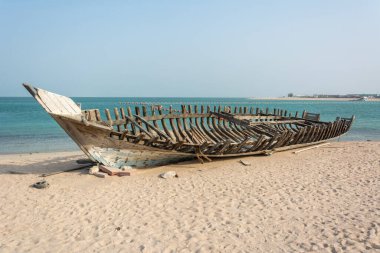 Wooden carcass of dhow fishing boat in Qatar.