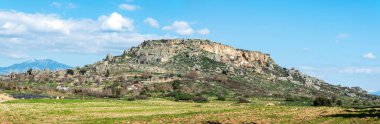 Rocky plateau with scattered ruins of Silyon ancient city in Antalya province of Turkey.