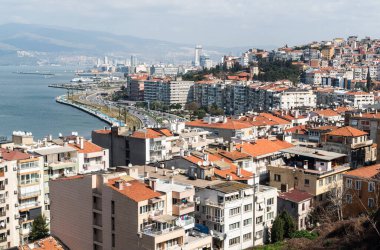 Izmir, Turkey - March 2, 2019. View over Konak district of Izmir, with residential buildings, cars and people. 