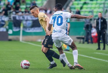 Budapest, Hungary - May 4, 2022. Ferencvaros midfielder Lorand Paszka against Zalaegerszeg striker Meshack Ubochioma during Hungarian OTP Bank Liga Gameweek 31 match Ferencvaros vs Zalaegerszegi (5-3).