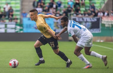 Budapest, Hungary - May 4, 2022. Ferencvaros midfielder Lorand Paszka against Zalaegerszeg striker Meshack Ubochioma during Hungarian OTP Bank Liga Gameweek 31 match Ferencvaros vs Zalaegerszegi (5-3).