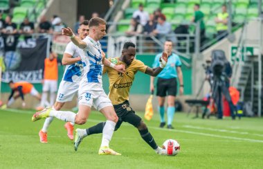 Budapest, Hungary - May 4, 2022. Ferencvaros striker Franck Boli against Zalaegerszeg centre-back Nikola Serafimov during Hungarian OTP Bank Liga Gameweek 31 match Ferencvaros vs Zalaegerszegi (5-3).