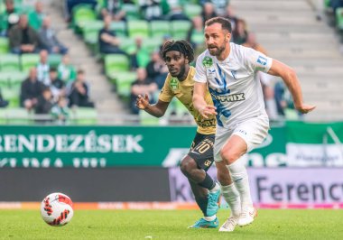 Budapest, Hungary - May 4, 2022. Ferencvaros striker Tokmac Nguen and Zalaegerszeg  during Hungarian OTP Bank Liga Gameweek 31 match Ferencvaros vs Zalaegerszegi (5-3)