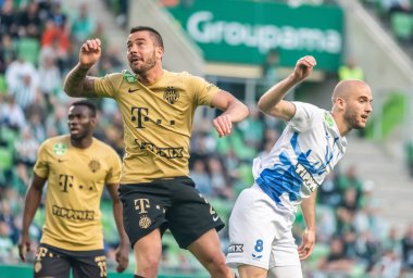 Budapest, Hungary - May 4, 2022. Ferencvaros defender Samy Mmaee and Zalaegerszeg midfielder Matyas Tajti in a header during Hungarian OTP Bank Liga Gameweek 31 match Ferencvaros vs Zalaegerszegi (5-3).
