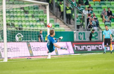 Budapest, Hungary - May 4, 2022. Ferencvaros goalkeeper Denes Dibusz conceding a penalty goal during Hungarian OTP Bank Liga Gameweek 31 match Ferencvaros vs Zalaegerszegi (5-3).