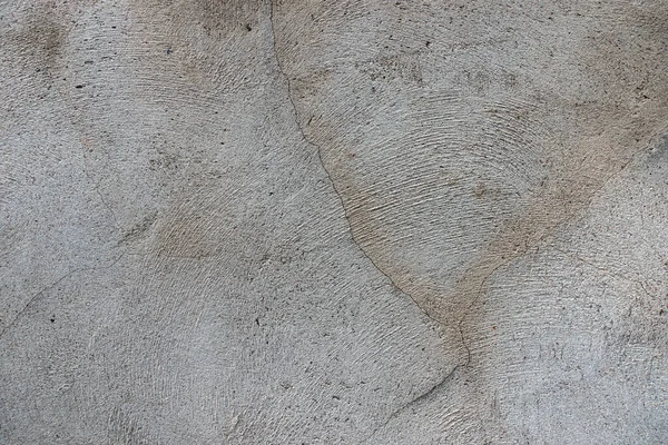 Parede de gesso de concreto cinza escuro com fundo de textura rachado sujo — Fotografia de Stock