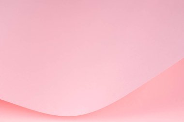 Soyut pembe renkli kağıt dalgası. Işık ve gölgeli yaratıcı geometrik kavisli kağıt. Kopya alanı ile soyut monokrom arkaplanı