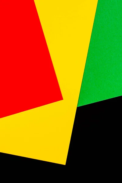 Αφηρημένο γεωμετρικό μαύρο, κόκκινο, κίτρινο, πράσινο χρώμα φόντο. Μαύρο φόντο χρώματος μήνα ιστορίας με χώρο αντίγραφο για το κείμενο — Φωτογραφία Αρχείου
