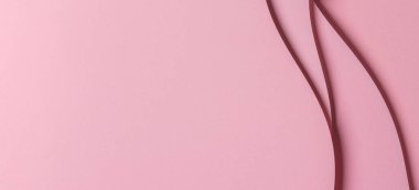 Soyut renkli kağıt geometri kompozisyonu, tek renkli arkaplan, kıvrımlı çizgiler ve pembe renkte.