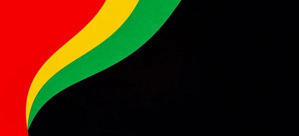 Αφηρημένο γεωμετρικό μαύρο, κόκκινο, κίτρινο, πράσινο χρώμα φόντο. Μαύρο φόντο χρώματος μήνα ιστορίας με χώρο αντίγραφο για το κείμενο — Φωτογραφία Αρχείου