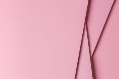 Soyut tek renkli arkaplan. Kopya alanı ile yaratıcı geometrik pastel pembe kağıt arkaplan