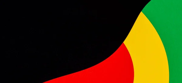 Astratto sfondo geometrico di colore nero, rosso, giallo, verde. Storia nera Mese sfondo a colori con spazio di copia per il testo — Foto Stock