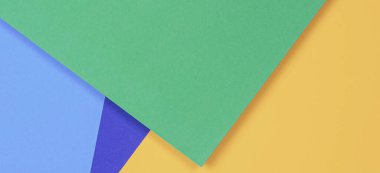 Yaratıcı soyut mavi, yeşil ve sarı renkli geometrik kağıt kompoziton afiş arkaplanı, üst görünüm