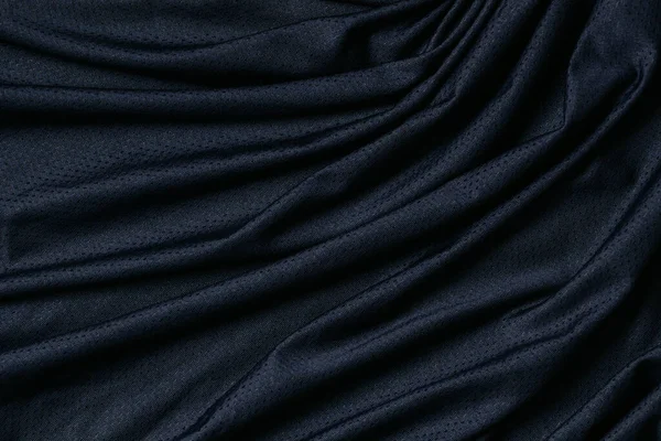 Sportovní oblečení textura pozadí. Navy modrá tkanina sportovní oblečení fotbalový dres se vzduchovou síťovinou textury pozadí. Horní pohled — Stock fotografie
