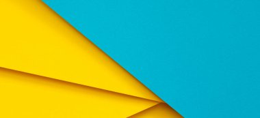 Soyut renk kağıtları geometri düz kompozisyon arka planı mavi ve sarı tonlarla