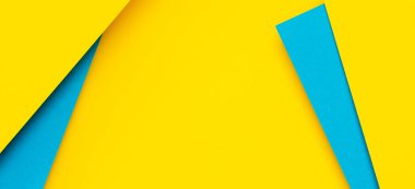 Soyut renk kağıtları geometri düz kompozisyon arka planı mavi ve sarı tonlarla