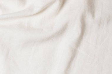 Beyaz buruşmuş kumaş dokusu arka planı. Doğal keten organik eko tekstil tuval arka planı. Üst görünüm