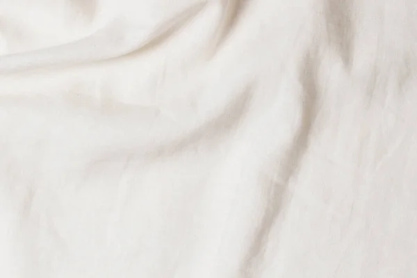 Białe pogniecione tło tekstury tkaniny lnianej. Naturalny len organiczne tkaniny ekologiczne tło płótna. Widok z góry — Zdjęcie stockowe