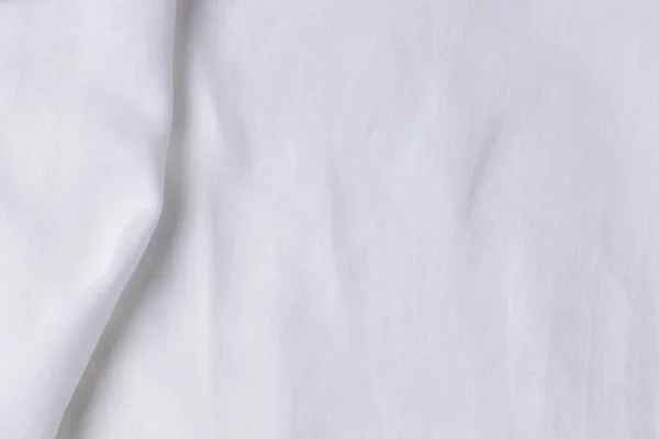 Białe pogniecione tło tekstury tkaniny lnianej. Naturalny len organiczne tkaniny ekologiczne tło płótna. Widok z góry — Zdjęcie stockowe