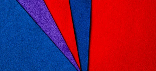 Abstract colorful geometric felt texture background. Bright blue, red, purple colors felt textile for craft. Top view, flat lay — Zdjęcie stockowe
