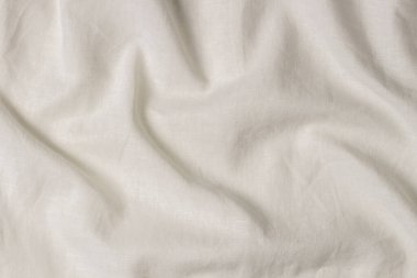 Beyaz buruşmuş kumaş dokusu arka planı. Doğal keten organik eko tekstil tuval arka planı. Üst görünüm