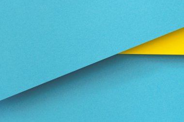 Soyut renk kağıtları geometri düz kompozisyon arka planı mavi ve sarı tonlarla