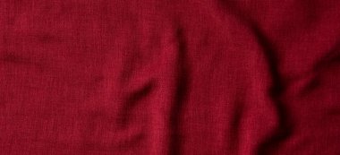 Kırmızı buruşmuş keten kumaş dokusu arka plan. Doğal keten organik eko tekstil tuval arka planı