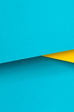 Soyut renk kağıtları geometri düz kompozisyon arka planı mavi ve sarı tonlarla