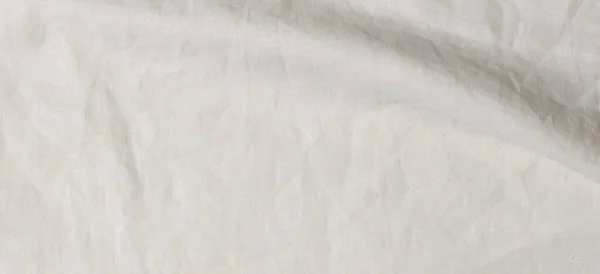 Abstraktní lněné tkaniny textury pozadí. Zmačkaný z bílého přírodního ložního prádla ekologické textilie plátno pozadí. Horní pohled — Stock fotografie