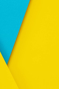 Soyut renk kağıtları geometri düz kompozisyon arkaplan mavi ve sarı tonlu. Üst görünüm