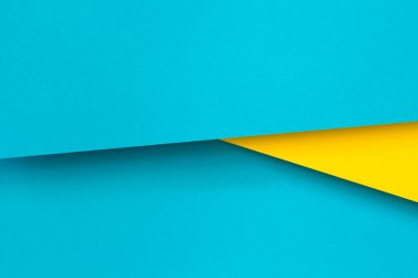 Soyut renk kağıtları geometri düz kompozisyon arkaplan mavi ve sarı tonlu. Üst görünüm