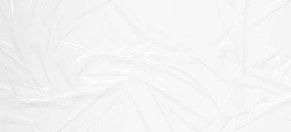 Transparante Plastic Omslag Witte Achtergrond Gekrompen Gerimpeld Plastic Cellofaan Reflecterend — Stockfoto