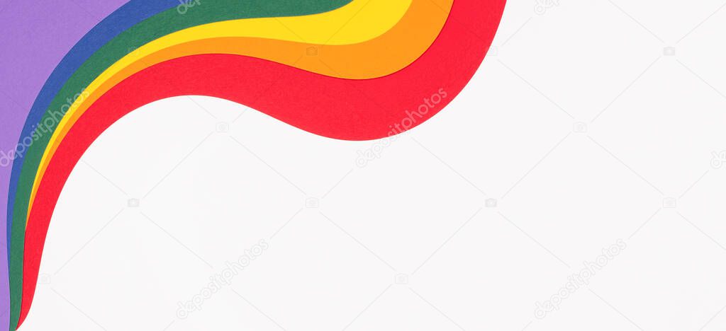Lgbtq colors flag paper layout on white background. Pride community. Rainbow colors layout background. Top view, copy space.