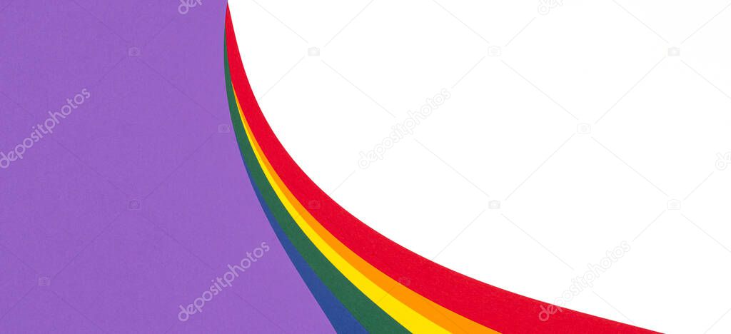 Lgbt pride month. Lgbtq colors flag paper layout on white background. Rainbow colors layout background. Top view, copy space.
