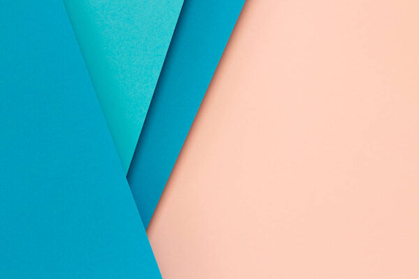 Abstract color papers geometry flat lay composition background with blue and light pink color lines and shapes. Top view.