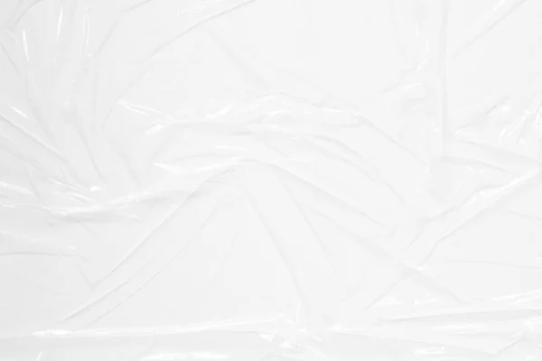Transparante Plastic Omslag Witte Achtergrond Gekrompen Gerimpeld Plastic Cellofaan Reflecterend — Stockfoto