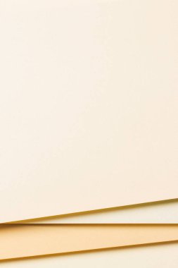 Soyut renkli kağıt dokusu arkaplanı. Geometrik şekiller ve nötr bej kahverengi tonlarda çizgilerle minimum dikey bileşim.