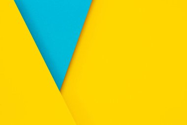 Soyut renkli kağıt arkaplan. Açık mavi ve sarı renkli minimum geometrik şekiller ve çizgiler. Üst görünüm