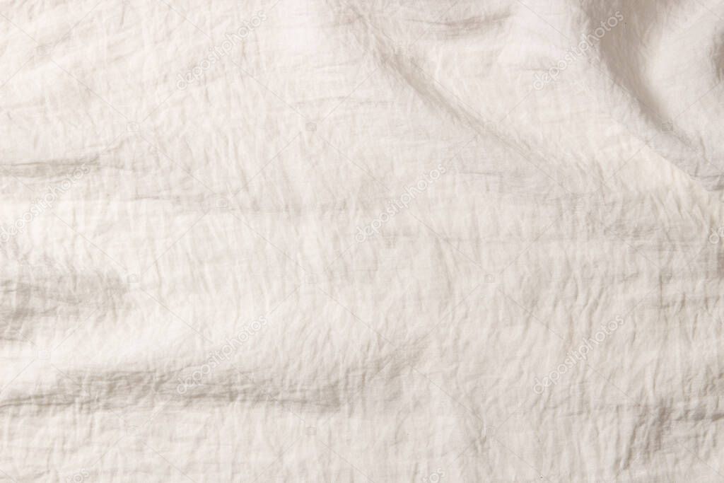 White crumpled fabric texture background. Natural organic eco textiles canvas banner background. Top view.