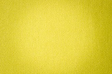 Sarı renk keçeli kumaş dokusu arkaplanı.