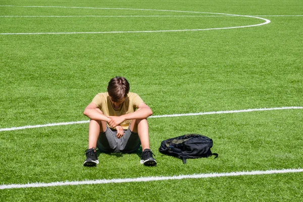 Sad Alone Teenage Boy Backpack Sitting Empty Sport Stadium Outdoors — Foto de Stock