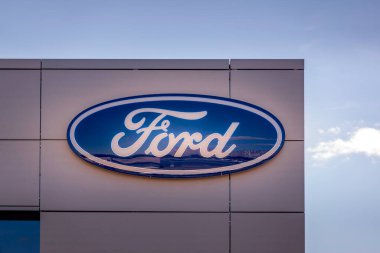 Vilnius, Lithuania- July 29, 2022: Ford logo on a dealerships building. The Ford Motor Company is American multinational automaker company.