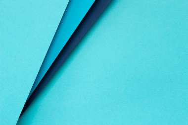 Abstract color papers geometry flat lay composition background with light blue, navy color lines and shapes. Top view, copy space.
