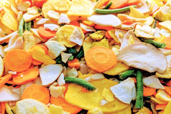 Mixture of dried vegetables. Healthy vegetable chips. Vegan, vegetrian food, healthy snack. Top view.