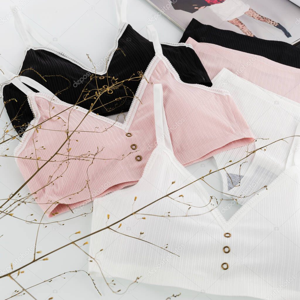 women's underwear, bra, underpants, white, black, pink, layout on a white background