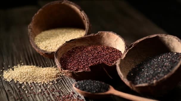 Different Varieties Quinoa Coconut Bowl Wooden Spoon Old Wooden Background — Stock Video