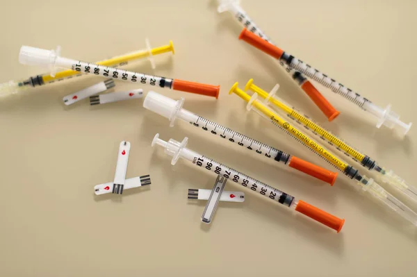 Disposable syringes for diabetes treatment, blood sugar test strips, lifestyle, disease, close-up