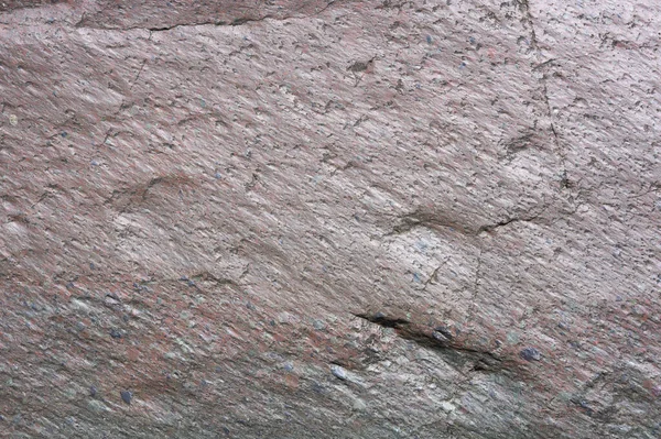 照片显示了石头的质地 石纹是粉红色的大理石 在加勒比海岛上的高山上的野外见到了石头 石头的表面很光滑 — 图库照片