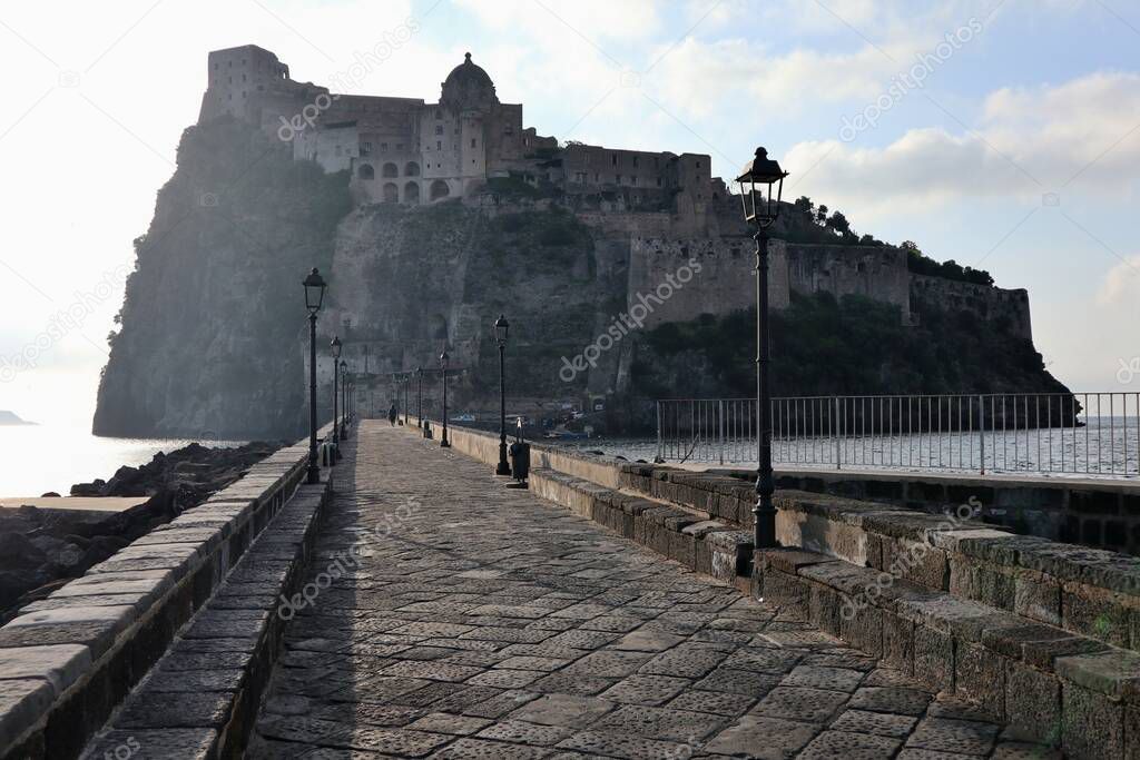 Ischia, Campania, Italy - May 13, 2022: Aragonese Castle from the access bridge in the early morning